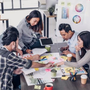 Group of people talking about documents on table