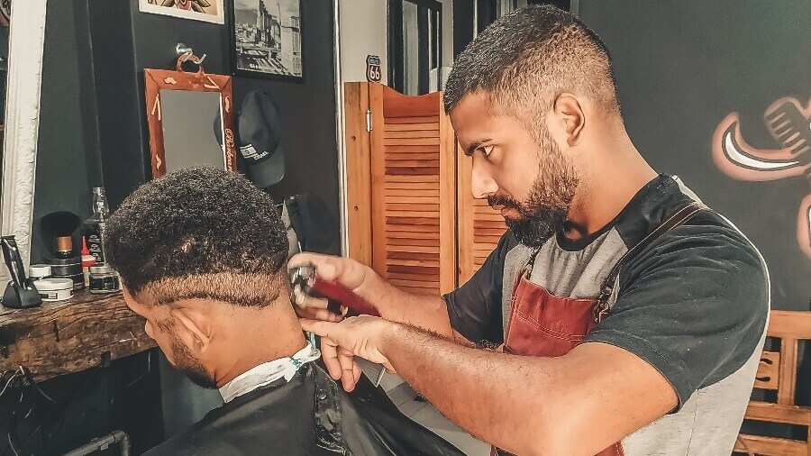 barber cutting client's hair