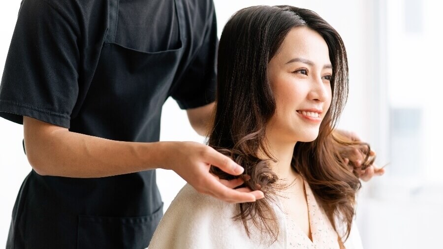 hair stylist styling client's hair