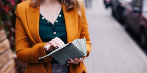 woman opening wallet