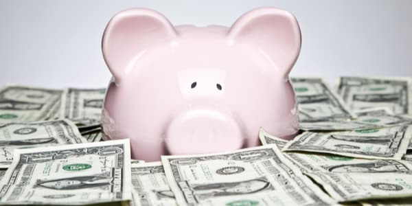 piggy bank in a pile of money