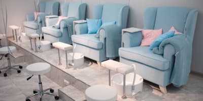 blue chairs at a nail spa