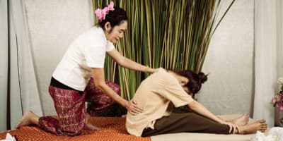 woman getting a thai massage