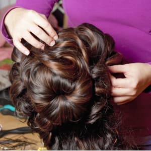 Wig Maker styling a wig