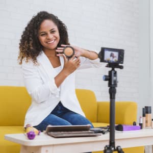 woman displaying makeup in front of camera