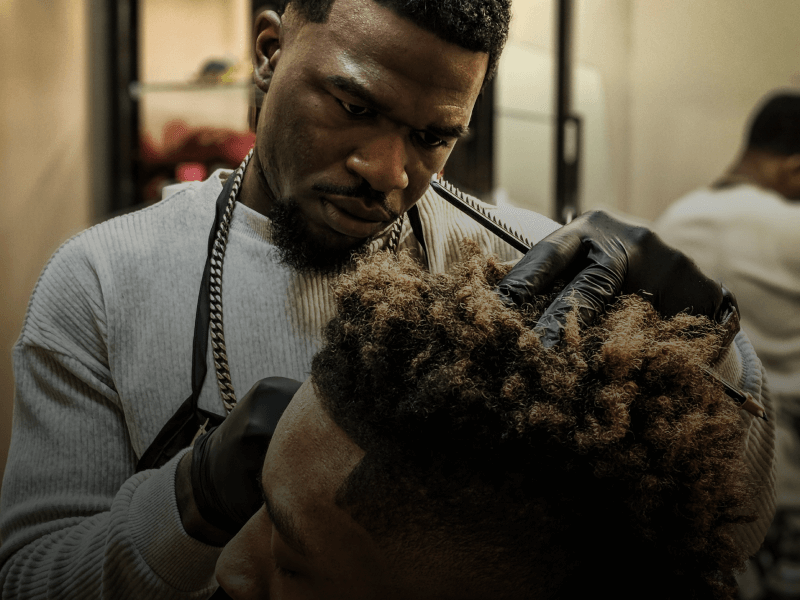 barber cutting client's hair